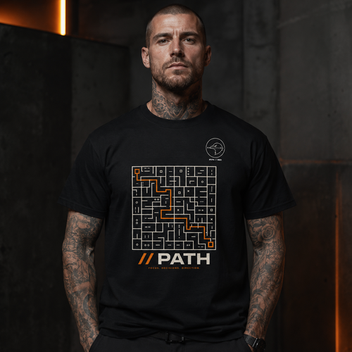 Model wearing // PATH Grim Raven Labs graphic tee in dark industrial streetwear setting